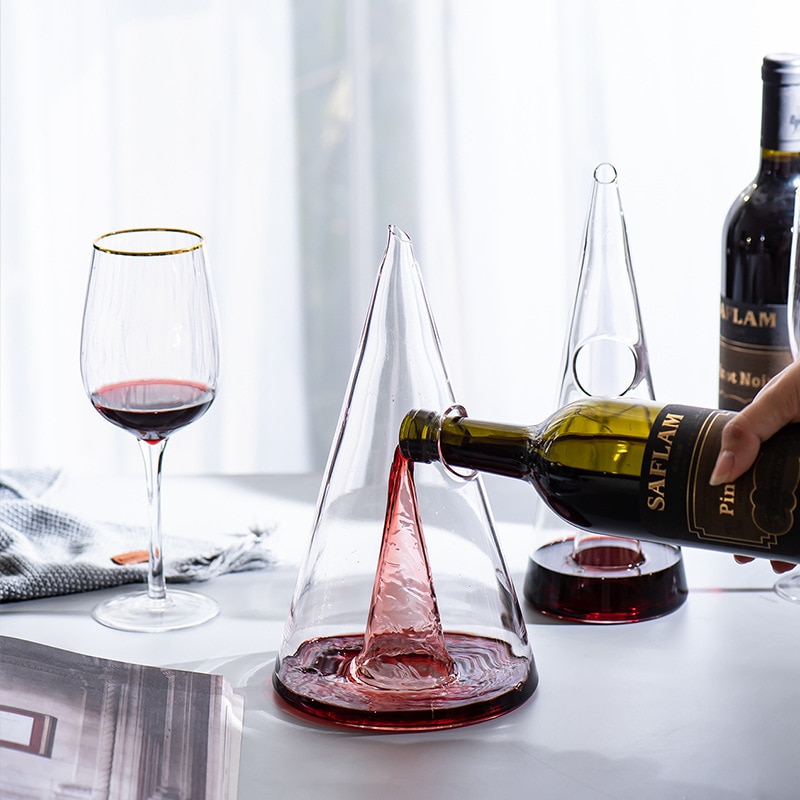 Pouring wine into a wine decanter Pouring wine into a wine decanter